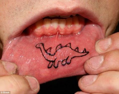 While an inner lip inking is usually a single word scrawled across the skin of the lower lip, some opt for a more adventurous design, with outlines of objects and even coloured shapes. Lip Tats, Inside Lip Tattoos, Inner Lip Tattoo, Angel Bites, Infected Tattoo, Mouth Tattoo, Angel Tattoos, William Ellis, Lip Tattoos