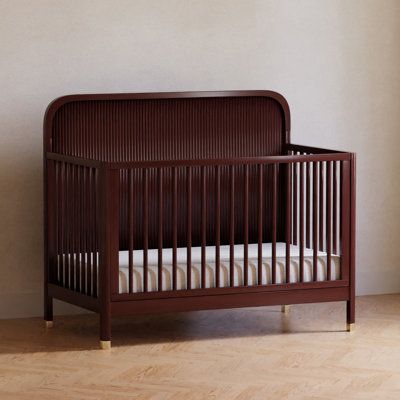 The Brimsley Tambour crib is a masterpiece of craftsmanship that blends timeless design with modern functionality. Its distinctive tambour design and gently curved slats, paired with elegant gold feet, make this crib more than just a place for your little one to rest. It's a statement piece that elevates the aesthetic of your nursery.​ Color: Crimson Namesake Brimsley Tambour 4-in-1 Convertible Crib - Cribs in Crimson | Size Standard | Birch Lane Forest Baby Nursery, Red Crib, Brown Crib, Nursery Color, Red Nursery, Vintage Baby Nursery, Wood Crib, Forest Baby, Nursery Room Design