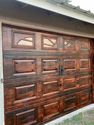 Revamp Those Garage Doors Painted Garage Doors Ideas, Paint Garage Door To Look Like Wood, Paint Metal Garage Door To Look Like Wood, Faux Wood Garage Door Farmhouse, How To Paint Faux Wood Grain Garage Door, Faux Wood Garage Door Diy, Garage Door Update, Wood Garage Doors With Datk Stain, Bilco Doors