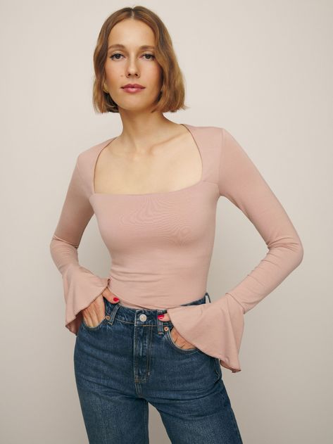 May cause compliments. Shop the Lucca Knit Top from Reformation, a long sleeve top with a straight neckline and slightly flared sleeve cuffs. Wrap Top Outfit, Frilly Blouse, Blush Pink Color, High Rise Wide Leg Jeans, Pretty Top, Lucca, Wide Leg Jeans, Jersey Fabric, Fabric Care