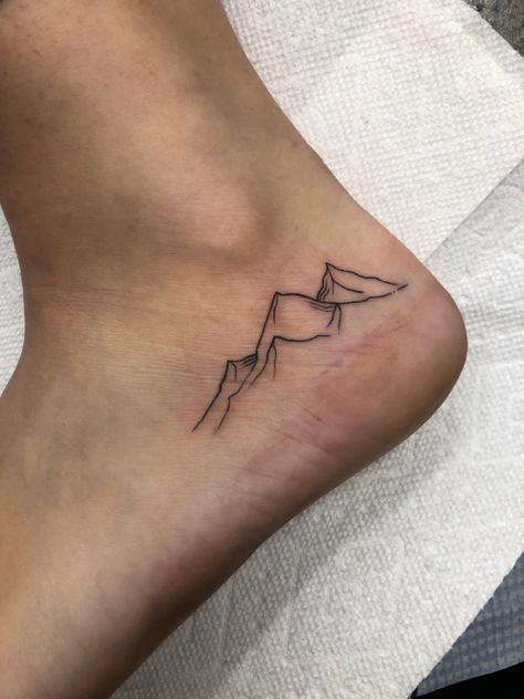 Moutain Tattoos Ankle, Mountain Tattoo Ankle, Outdoor Tattoo For Women, Tiny Leg Tattoos, Granola Tattoo Ideas, Outdoors Tattoos For Women, Granola Tattoo, Fine Line Mountain Tattoo, Ankle Tats