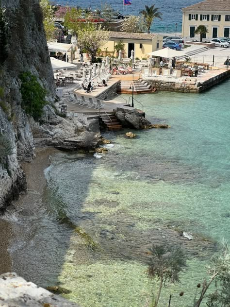 greece island corfu crystal clear water rocky coast Greek Coast Aesthetic, Greek City Aesthetic, Corfu Photo Ideas, Greece Aestethic, Greek Islands Aesthetic, Corfu Greece Aesthetic, Greece Coast, Greek Island Aesthetic, Greek Coast