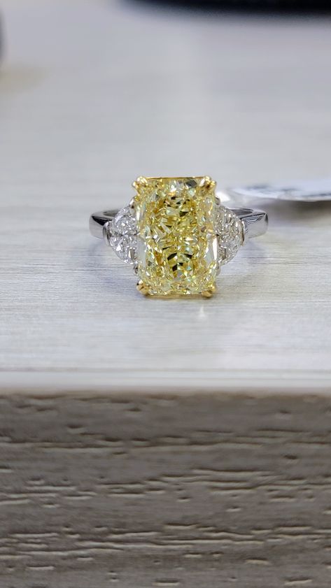 Extremely elongated and gorgeous 5ct Fancy Light Yellow Radiant with an impressive 1.43 ratio Strong color like a Fancy Yellow VVS clarity Set in Platinum and 18kt Yellow Gold with 0.62ct of D VS Half Moons Yellow Canary Diamond Ring, Yellow Engagement Ring, Fancy Yellow Engagement Ring, Canary Diamond Ring, Fancy Yellow Diamond Ring, Yellow Diamonds Engagement, Canary Diamond, Yellow Diamond Engagement Ring, Half Moons