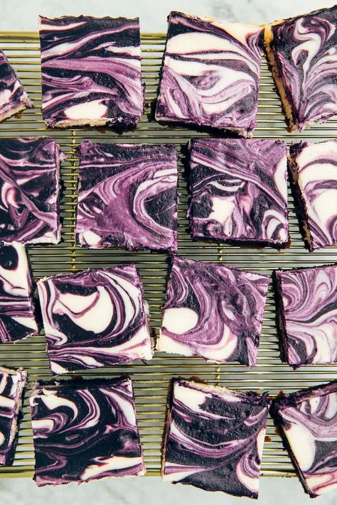 photo of sliced ube cheesecake bars on gold wire rack Ube Cheesecake Brownies, Ube Brownies, Flavored Cheesecake, Ube Cheesecake, Sour Cream Cheesecake, Ube Recipes, Family Mart, Cream Cheesecake, Cheesecake Bar Recipes