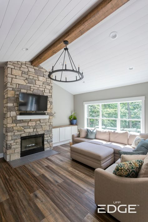 This home ceiling features our Timeless Farmhouse White shiplap. A smooth, white ceiling like this brings clean lines and brightens up a room. See how to install shiplap on your home ceiling. #shiplap #timeless #homeceiling #shiplapceiling Shiplap Ceiling With Beams Living Room, Shiplap On Vaulted Ceiling, White Wood Plank Ceiling, White Plank Ceiling Living Room, Farmhouse Ceiling Ideas Living Room, Shiplap Wall Vaulted Ceiling, Vaulted Shiplap Ceiling Living Room, Shiplap On Ceiling In Living Room, Farmhouse Shiplap Ceiling