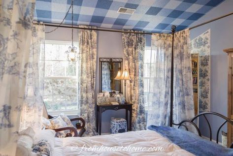 Are you living in a builder-grade house and don't want it to feel like a builder grade house? See our Builder Grade Bedroom Makeover for inspiration. Blue Toile Bedroom, Toile Bedroom, Painting The Ceiling, Iron Canopy Bed, Black Walls Bedroom, Blue And White Toile, Dramatic Bedroom, Small Baby Room, Wrought Iron Beds