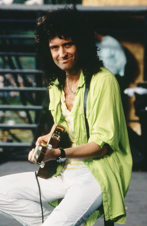 No you know why I always wear a big unbuttoned shirt over another shirt underneath and sometimes use funky colors. Shirt Unbuttoned, Queen Guitarist, Brain May, Queen Brian May, Princes Of The Universe, Artist Cartoon, May Queen, Best Guitarist, Pop Queen