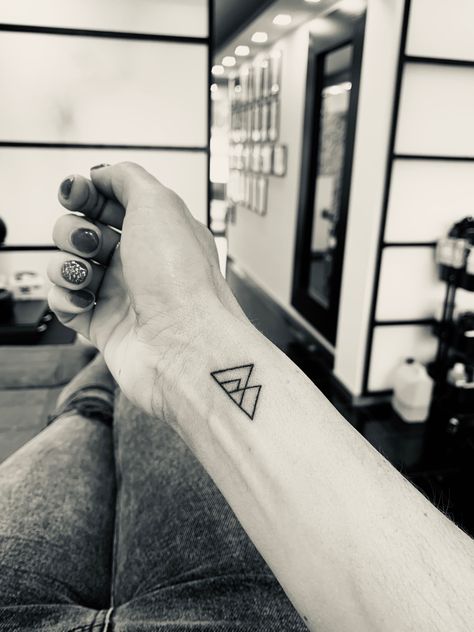 Family of 4 - family mountain - wrist tattoo. 4 Triangle Tattoo Family, Triangle Family Tattoo Ideas, Mountain Family Tattoo, Tattoo For Family Of 4, Tattoos For Family Of 4, Blended Family Tattoo, Triangle Mountain Tattoo, Mini Mountain Tattoo, Family Of 3 Tattoo Ideas