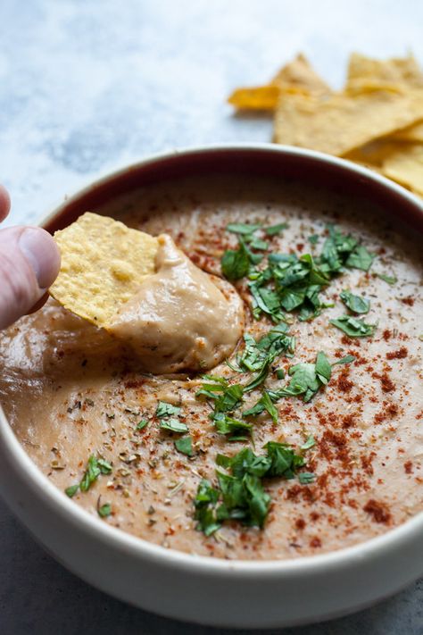 Cheesy Pinto Bean Dip - ready in no time and is perfect for game day. Also great as a nacho topper! macheesmo.com #pintobeans #dips #appetizers #easyrecipes Instant Pot Bean Dip, Pinto Bean Dip Recipes, Pinto Bean Dip, Dips Appetizers, Bean Nachos, Pinto Bean Recipes, Pinto Bean, Cooking Dried Beans, Using A Pressure Cooker