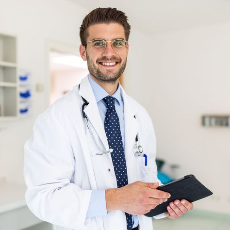 Portrait of a happy young doctor in his clinic Control Emotions, Doctor Images, Doctor Consultation, Rivaldo, Picture Of Doctor, Male Doctor, Doctor Picture, Pediatric Dentist, Primary Care Physician