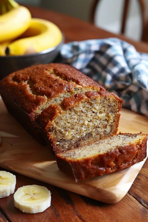 Banana bread loaf on a cutting board with a slice cut, next to bananas and a checkered cloth. Gluten Free Banana Bread Almond Flour, Banana Bread Without Flour, Rice Flour Banana Bread, Oat Banana Bread Recipe, Banana Bread Recipe Almond Flour, Banana Bread With Oat Flour, Healthy Gluten Free Banana Bread, Banana Bread With Almond Flour, Easy Gluten Free Banana Bread