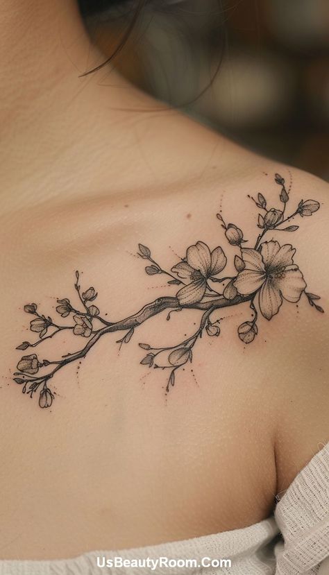 A black ink collarbone tattoo of a floral branch, featuring detailed line work and delicate flowers, creating a graceful and natural design. Small Collarbone Tattoo, Best Spine Tattoos, Collarbone Tattoo Ideas, Girl Spine Tattoos, Collarbone Tattoos, Simple Hand Tattoos, Symmetrical Tattoo, Small Neck Tattoos, Spine Tattoo Ideas