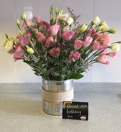 Flower arrangement - Eustoma in an upcycled tin can. 💐 Flowers In Tin Cans, Tin Can Floral Arrangements, Tin Vase, Vase Flower Arrangements, Flower Stall, Tin Can Flowers, 10th Anniversary Party, Recycled Tin, Afternoon Tea Party