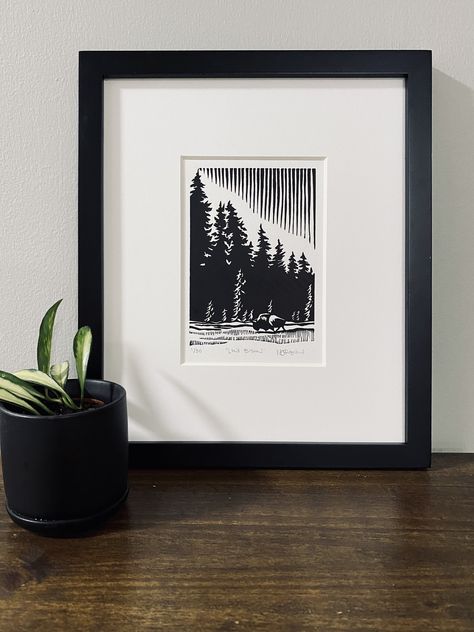 "Lone Bison" is a depiction of the solitary bull tucked away in the vast plains of Yellowstone National Park. Inspiration for this print came from long days spent exploring different areas of the park and seeing bison everywhere we went.  This is a hand carved and hand printed linoleum block print with black ink on white paper completed in 2023. Due to the handcrafted nature of this print, there may be some slight variations, this is what makes each print a unique piece of art.  The paper size is 5"x 7". The image size is approximately 4"x5.75".  This print is intended to fit in the standard 4x6 mat opening of an 8"x10" frame with a small border and signature line visible.  This is a limited edition, signed and numbered print. Linoleum Block Printing, Linoleum Block, Lino Art, Linocut Art, Linoleum, Lino Print, Linocut Prints, Paper Size, Linocut