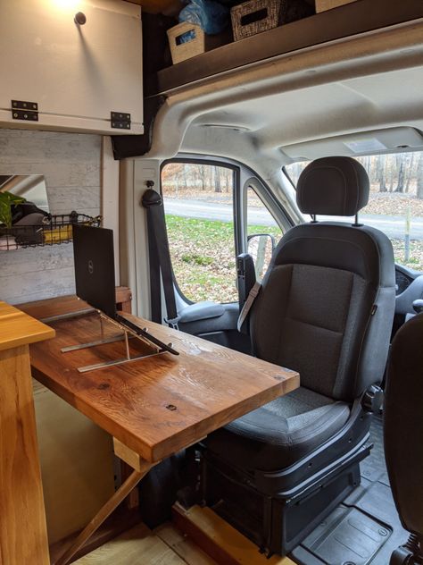 11 Ingenious Camper Van Office Ideas for Work on the Road Van Desk Work Spaces, Van Desk Ideas, Van Sliding Door Ideas, Camper Van Office Ideas, Van Life Work Space, Desk In Camper, Space Saving Van Conversion, Camper Workspace, Sprinter Van Office