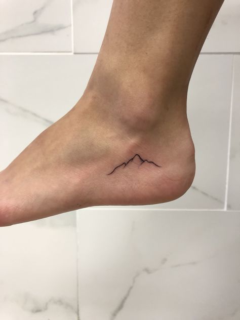 Mountain Tattoo On Ankle, Tiny Mountain Tattoo Simple, Mini Mountain Tattoo Simple, Small Mountain Range Tattoo, Mountain Heart Tattoo, Tiny Tattoo Mountain, Moutain Tattoos Simple, Simple Nature Tattoos For Women, Foot Tattoo Placement Ideas