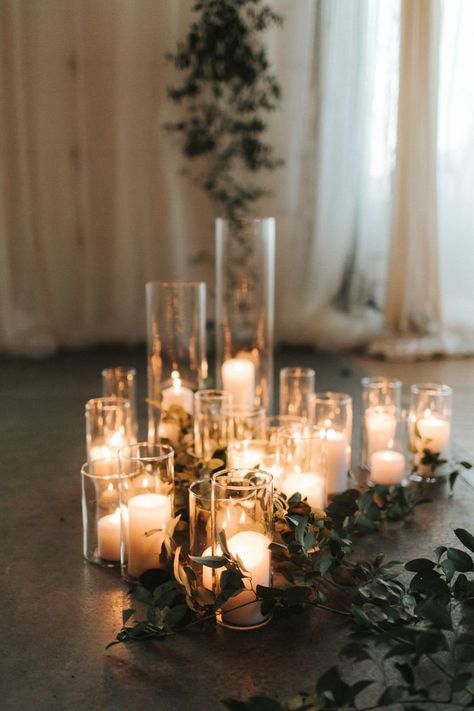 Simple white candles in glass vases added a warm touch to this indoor ceremony | Image by Gallivan Photo Nye Wedding Decor, White Candles Wedding, Wedding Candles Table, Wedding Ceremony Ideas, Nye Wedding, Candle Wedding Decor, Indoor Ceremony, Wedding Winter, Wedding Ceremony Decorations