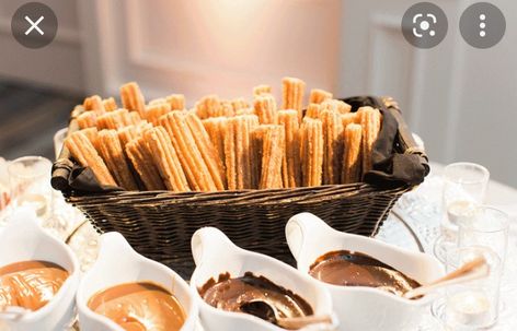 Set up for churros at a table in a basket Churros Bar, Churro Bar, Fiesta Wedding, Dessert Table Decor, Mexican Dessert, Food Stations, Wedding Dessert Table, Wedding Catering, Wedding Bar