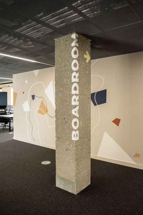 Vertical Signage, Column Wrap, Office Wall Design, Tiny Office, Wall Signage, Pillar Design, Painted Floor, Column Design, Exposed Concrete