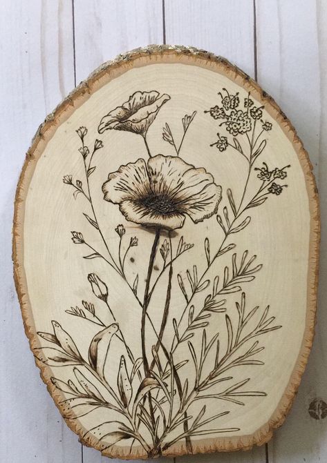 #woodburning #woodburningart #plantlady #plantlife #plants #garden #woodsliceart #homedecor #backyardlandscaping #spring #summerstyle #flowers #flowerarrangements #flowerart Wood Burn Wild Flowers, Woodburning Flowers Patterns, Wood Burning Plants, Flower Wood Burning Patterns, Wood Burned Flowers Design, Wood Burning Flower Designs, Wood Burning Stencil, Wood Burning Ideas Flowers, Flowers Wood Burning