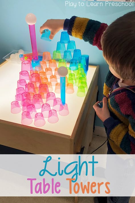 Challenge your young learners to use these colorful cups, tubes and balls to build their creations on the light table. It's art; it's engineering; it's fun! via @PlayToLearnPS Loose Parts Table Activities, Light Box Ideas Preschool, Light Board Activities Preschool, Dr Seuss Light Table Ideas, Lightbox Ideas Eyfs, February Light Table Ideas, Light Table Ideas For Toddlers, Toddler Light Table Activities, Light Box Ideas Eyfs