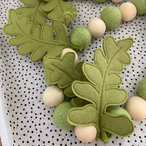 This listing is for one handmade fern garland (various lengths available). Each garland is made to order using 2cm felt balls and wooden beads. At intervals co-ordinating felt fern leaves have been threaded onto the natural waxed cord. Each leaf is made from a soft green felt, doubled up to make them sturdier and for a higher quality finish. There are two different sizes of fern leaves on this garland, giving it a jungle feel. They have been individually stitched to add detail (please see photog Felt Fern, Fern Garland, Felt Woodland, Flowers Felt, Felt Bunting, Dinosaur Bedroom, Felt Succulents, Jungle Decor, Felt Wall Hanging