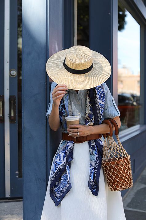 Preppy Summer Style | Wide Brim Straw Hat, Blue Silk Scarf, Net Bag White Shirt And Silk Scarf Outfit, Blue And White Scarf Outfit, Summer Silk Scarf, Scarf Styling Summer, Silk Scarf Summer Outfit, Summer Scarf Outfit Ideas, Summer Outfit With Scarf, Blue Silk Scarf Outfit, Scarf Summer