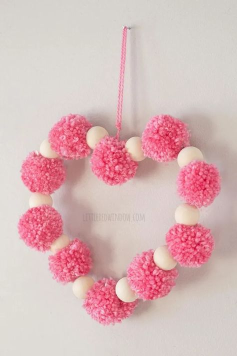 Valentine Pom Pom Heart Craft - Little Red Window Pom Pom Heart, Vday Crafts, Ribbon Wreath Diy, Diy Valentines Day Wreath, Valentine Wreath Diy, Pom Wreath, Valentine's Day Celebration, Heart Craft, Valentine's Day Wreath