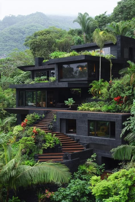 Modern dark concrete multi level house on a hillside in a lush rainforest there are large terraces with steps rooftop with gardens. See how modern tropical houses blend paradise with sleek design to create stunningly cool hideaways. Amazing Home Architecture, Industrial Mansion Exterior, Berkeley Hills House, Modern Rainforest House, Modern Sustainable Architecture, Step House Design, Rooftop Terrace Design Modern Houses, Rooftop Garden Design Modern, Modern Japanese Architecture Exterior