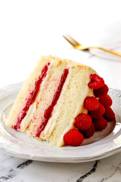 White Chocolate Raspberry Cake - Carlsbad Cravings Chocolate Cake With Raspberry Filling, White Chocolate Raspberry Cake, White Chocolate Cake, Chocolate Raspberry Cake, Carlsbad Cravings, Cake Layers, Raspberry Filling, Honey Buns, Raspberry Cake