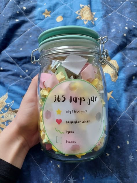 A glass jar filled with 365 notes as a gift to a boyfriend's birthday. There are 4 categories: why I love you's which are folded as origami stars, remember when's which are in a shape of heart, lyrics and doodles. 365 Days Jar, 365 Note Jar, Diy Valentines Gifts For Him, 365 Jar, Jar Of Notes, Quote Jar, Romantic Valentines Day Ideas, Happy Jar, Love Jar