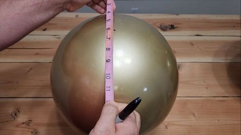 This festive season, we're diving into a fun and budget-friendly project using inflatable balls from your local dollar store or Dollar Tree. Let's get started on how to make giant jingle bells! Giant Jingle Bells, Jingle Bells Diy, Playground Balls, Getting Rid Of Mice, Bouncy Balls, Gold Spray Paint, Gold Spray, Black Acrylic Paint, Paint Marker