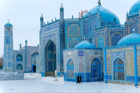 This is the Mazar-e Sharif Mosque located in Afghanistan. This Shrine was completed in the 15th century. This mosque has major significance to followers of Islam, as it was erected in the believed spot of the prophet Muhammad’s son-in-laws tomb. In addition to this, the mosque features intense beauty with its grand use of turqouise in its arabesque mosaic patterns that cover the entirety of the shrine/mosque. White marble covers the ground of both the interior and exterior. Medina Mosque, Iphone Wallpaper Landscape, Archi Design, Blue Mosque, Beautiful Mosques, Hazrat Ali, 1% Wallpaper, Blue City, The Prophet