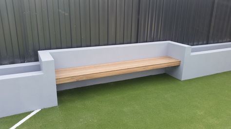 Floating bench seat using Blackbutt decking and rendered concrete block wall for our client in Coburg. Built In Bench Outdoor Seating, Diy Outdoor Built In Seating, Garden Wall Bench Seat, Planter With Bench Seat, Rendered Bench Seat Outdoor, Cement Bench In Garden, Outdoor Floating Bench, Rendered Seating Area, Garden Wall Bench