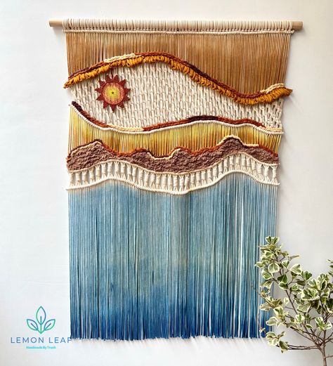 Welcome to my Etsy store. Let the "Ocean Dream" macrame wall art breathe a new life into your living space. This handcrafted piece is made from the finest materials, including unbleached natural cotton, premium merino wool, and smooth cotton fibers, promising to highlight every corner of your home. Inspired by the image of a majestic fish dancing over towering waves, the artwork reflects the glorious sunset on the ocean, creating a beautiful and vibrant scene. This wall art is not just an artist Ocean Living Room, Fish Dancing, Wall Art Over Bed, Over Bed Decor, Painting Of Sunset, Art Over Bed, Ocean Living, Sunset Over The Ocean, Macrame Wall Hanging Large