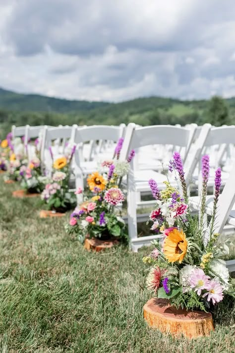 Wildflower Table Decor Wedding, Country Spring Wedding Colors, Wildflower Chair Decor, Wildflower And Eucalyptus Wedding, Boho Wildflower Wedding Table Decor, Pampas And Wildflower Wedding, Wildflower Themed Wedding Decor, Summer Wild Flower Wedding, Wild Flower Wedding Arbor