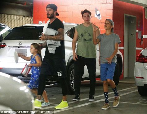 David Beckham takes kids Brooklyn, Romeo and Harper to the gym David Beckham Gym, Beige Sneakers, Man About Town, Yellow Sneakers, Fitness Facilities, Guy Gifs, All In The Family, Blue Socks, Black Sweatpants