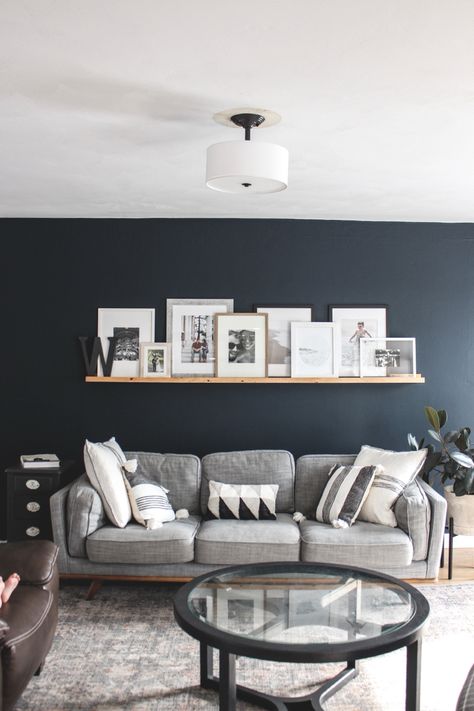 Living Room With Navy Walls, Living Room Designs Wall Color, Navy Grey And Wood Living Room, Living Room One Wall Painted, Grey Couch Blue Walls Living Room Ideas, Color To Paint Living Room Ideas, Navy Tv Room, Cozy Navy Living Room, Navy Living Room Accent Wall