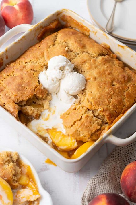 Satisfy your peach cravings with this delicious gluten-free peach cobbler. This easy recipe uses fresh peaches and brown sugar for a sweet filling and an old-fashioned buttery topping. Perfect for summer! It is my favorite gluten-free recipe with peaches. Gf Peach Cobbler, Recipe With Peaches, Gluten Free Cobbler, Peach Cobbler With Bisquick, Gluten Free Peach Cobbler, Peach Healthy, Raspberry Cobbler, Gluten Free Christmas Recipes, Fresh Peach Recipes