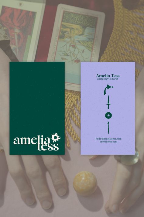 The Amelia Tess logo is a beautiful serif font with an illustration of the sun, representing rebirth and renewal. The logo and brand colors of purple and green are used throughout the brand identity, which includes hand-drawn tarot symbols as accents. The branding is modern, inviting, and mystical, perfect for a trauma-informed astrologer and tarot reader. This branding project was created by Gerda, a brand designer, and can be viewed in full on her website. Purple And Green Graphic Design, Purple And Green Branding, Tarot Branding, Tarot Symbols, Graphic Designer Studio, Tarot Business, Green Branding, Brand Colours, Buisness Cards