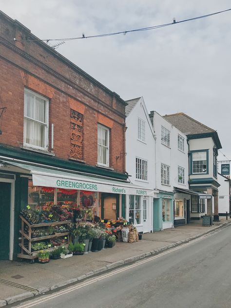 Topsham, Devon. Greengrocers, flowers, old English town. English Town, Old English Town, British Town Aesthetic, Old English Town Aesthetic, Old English Village Aesthetic, England Town Aesthetic, Small Town Aesthetic England, Topsham Devon, A Level Textiles