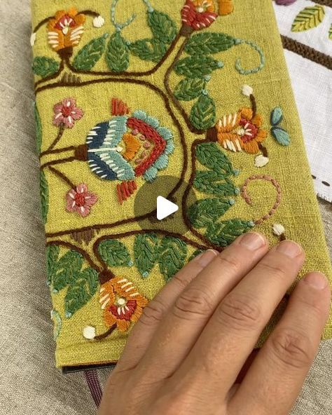 Kasia Jacquot on Instagram: "I write down my dreams and decorate the pages. The cover is hand embroidered. This way it feels like I’m writing in a magic book that makes it all come true. This is one of my many hand embroidered journals. Today I’m making another one. Stay tuned. ❤️" Embroidery On Book Cover, Open Book Embroidery, Embroidery Book Cover, Kasia Jacquot Embroidery, Embroidered Journal Covers, Embroidered Book Cover, Hand Embroidered Book Cover, Embroidery Book, January 22