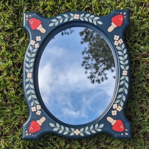 Little weird shaped mirror with hand painted mushrooms 🍄 Painted Wooden Mirror, Mushroom Painting On Mirror, Small Painted Mirrors Aesthetic, Painted Mirror, Tiny Mirror Painting, Handpainted Wood Mirror, Mirror Paint, Quirky Decor, Hand Mirror