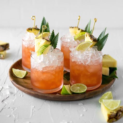 TGIF 🤪 The best day to share a delish cocktail with you! This one is cutely named 'Free as a (jungle) bird'... (serves 4) INGREDIENTS: 240 ml Master of Mixes Mai Tai Mixer (Uncle Dan's has alternatives) 90 ml Campari 180 ml spiced rum lime wedges, to garnish pineapple slices, to garnish pineapple leaves, to garnish (optional) TO MAKE: In a large pitcher, combine all the ingredients and stir well. Fill glasses with crushed ice and top each with the jungle bird cocktail. Garnish with a lime... Tropical Cocktail Garnish, Pineapple Leaf Garnish, Jungle Bird, Pineapple Leaves, Cocktail Garnish, Pineapple Slices, Mai Tai, Spiced Rum, Crushed Ice