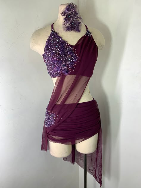 Lyrical Dance Costume . Shown in merlot/ plum with beaded Appliques and Swarovski ab and crystal ab Rhinestones. Matching headpiece with Crystal AB rhinestones Matching attached brief and assymetrical skirt with rhinestones on the applique. Matching hairpiece. Gorgeous in this color way but can also be custom ordered in another color. Can be custom made to your measurements. Can be custom ordered in any color or size. SIZING CHART: Sizing: Bust Waist hips Girth Inseam X small child XSC 21-23 19- Diamond Dance Costume, Mauve Dance Costume, Dance Competition Costumes Jazz, Blue Lyrical Costume, Lyrical Dance Costumes Solo, Sparkly Dance Costume, Red Dance Costumes, Dance Costume Lyrical, Skirt With Rhinestones