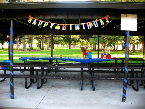 Outdoor party at a park pavilion, decorated using streamers, banner, and tablecloths in primary colors from the $store. Pavilion Party Ideas, Pavillion Decoration Ideas, Pavillion Birthday Party, Park Pavilion Decorations Birthday, Party At A Park, Park Birthday Party Ideas, Party At Park, Picnic Table Decor, Backyard Kids Party