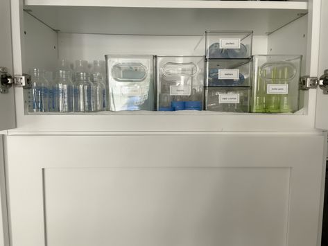 📣 Calling all parents! If you are struggling with organizing your baby bottles in the kitchen The Home Edit line from WalMart is fantastic to be able to sort, stack and keep your bottles in order. How do you organize the baby items in your kitchen?  #OrlandoOrganizer #WinterparkOrganizer #WinterGardenOrganizer #Longwood #DeclutterOrlando #ClosetOrganization #OrlandoHomeOrganizer #OrlandoProfessionalOrganizer Kitchen Baby Bottle Organization, Baby Bottle Cabinet Organization, Organizing Baby Bottles, Long Term Baby Bottle Storage, Organizing Baby Bottles In Kitchen, Bottle Organization Baby, Baby Cabinet, Baby Bottle Storage, Plate Organizer