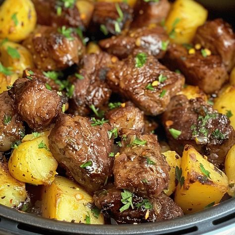 Transform your mealtime into a quick and savory delight with "Quick Feast: Air Fryer Garlic Butter Steak Bites and Potatoes." This recipe leverages the convenience and speed of an air fryer to create a succulent, Air Fryer Steak And Potato Bites, Steak And Potato Air Fryer, Steak Bites And Potatoes With Garlic Butter Air Fryer, Garlic Butter Herb Steak Bites With Potatoes Instant Pot, Air Fryer Garlic Butter Steak Bites And Potatoes, Air Fryer Garlic Steak Bites And Potatoes, Meat Bites Recipes, Airfryer Steak And Potatoes, Steak And Potatoes In Air Fryer