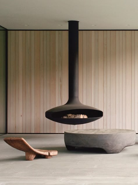 Insider's Guide to Artisanal Suspended Fireplaces | est living Round Island, Dream Fireplace, Suspended Fireplace, Rooftop Apartment, Concrete Stool, Fireplace Modern, Courtyard Patio, Garden Exterior, Concrete Counter