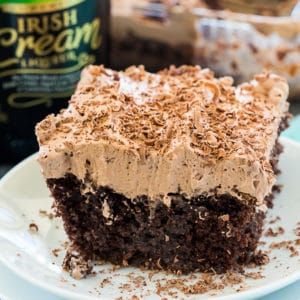 Irish Cream Poke Cake - Spicy Southern Kitchen Irish Cream Poke Cake, Desserts Potluck, Irish Cream Frosting, Irish Cream Cake, Cream Poke Cake, Spicy Southern Kitchen, Flavored Whipped Cream, Poke Cake Recipe, Cake Mix Ingredients